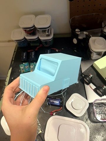 A light blue 3D-printed car top with a grille